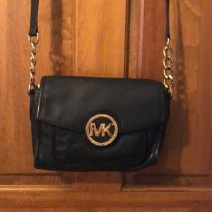 Beautiful Michael Kors black pebbled leather medium crossbody with gold accents